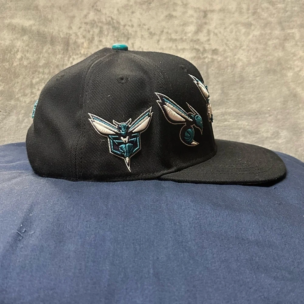 PRO Brand Charlotte Hornets Multi-Logo SnapBack Hat.